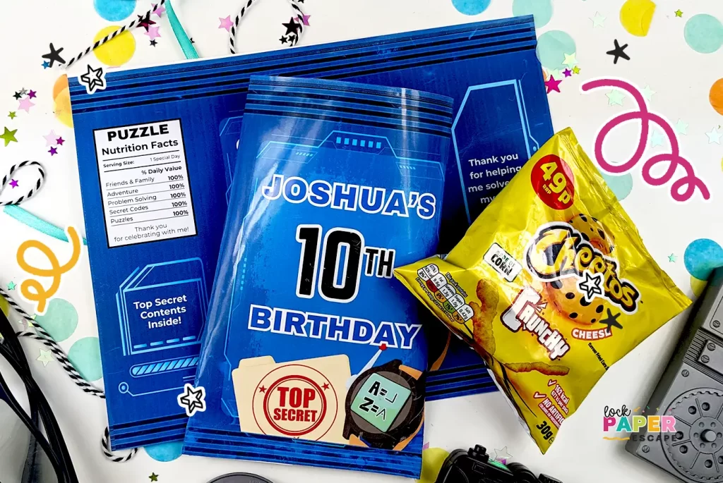 A blue party chip bag that says "Joshua's 10th Birthday" with a packet of Cheetos.