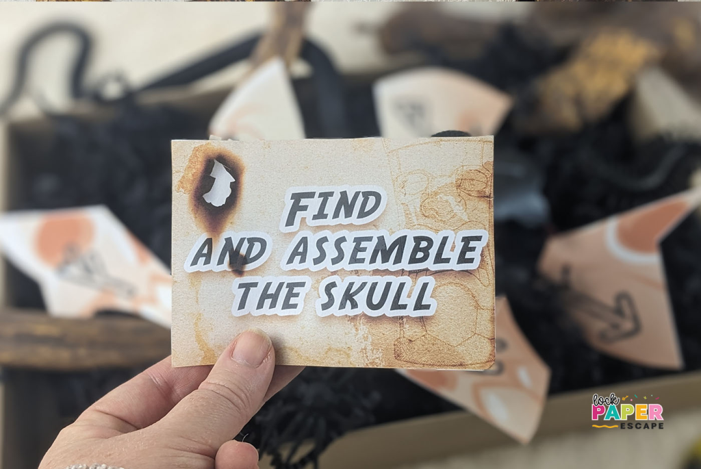 A clue card with the message that reads: Find and assemble the skull.
