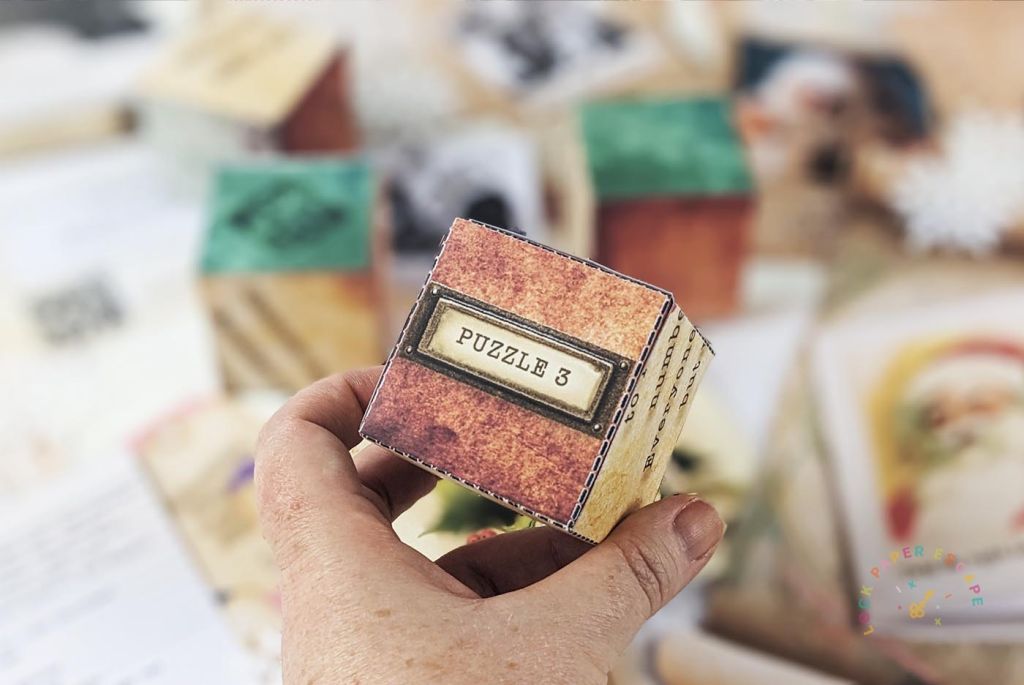 A cube with puzzle 3 written on it. A clue for a Christmas family escape room game.