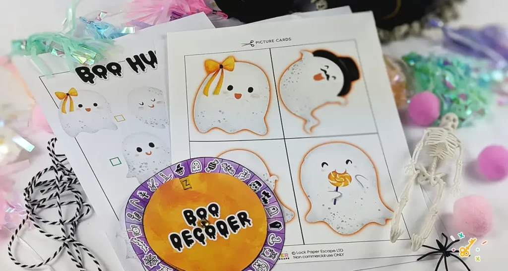 Ghost scavenger hunt printed out images with halloween decoration.