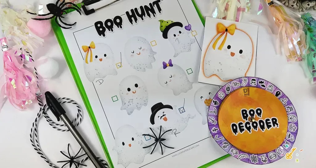 Ghost scavenger hunt game sheet on a clipboard, and the boo decoder wheel.