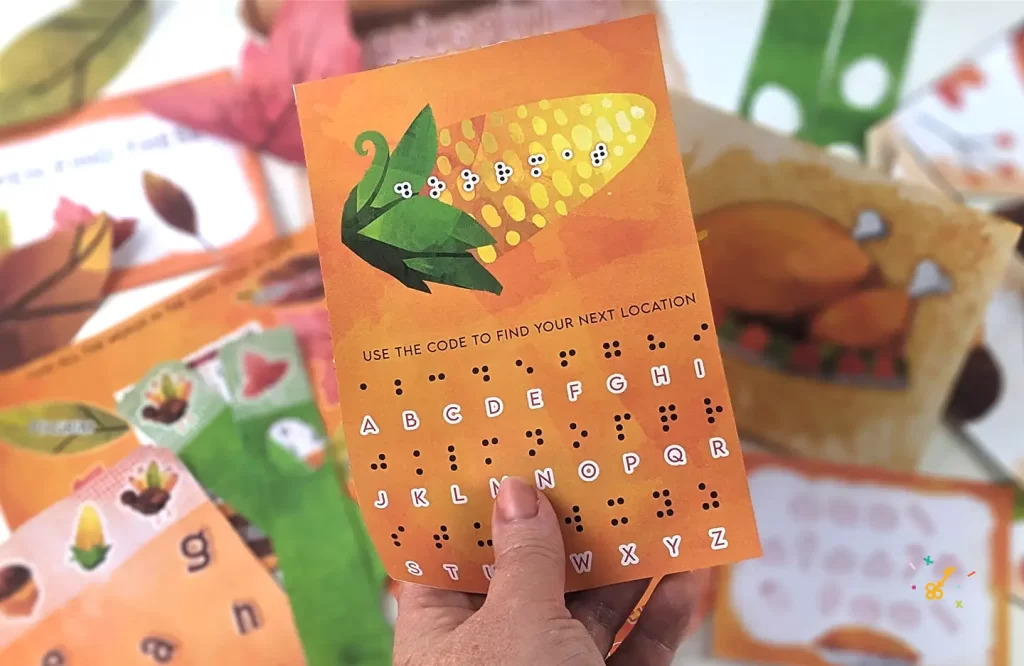 Thanksgiving escape room puzzle idea. A hand holding a clue page with a picture of corn.