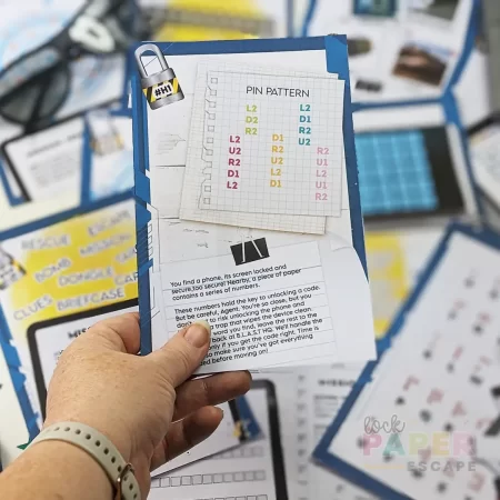 Printable spy game material. A hand holding a printed puzzle page.